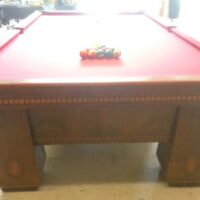 Brunswick Medalist pool table with the balls racked and ready for play
