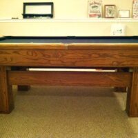 Side view of a used Brunswick Highlander pool table