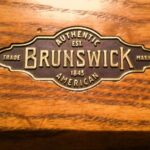 Brunswick plate logo on rail