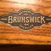 Brunswick plate logo on rail