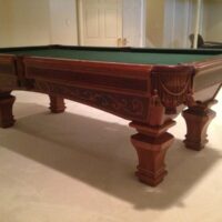 An Ashbee pool table from corner perspective