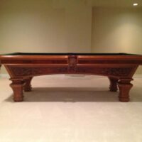 Side view of Brunswick Ashbee pool table.