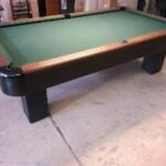 Brunswick Sportsman antique 8' pool table in our showroom.