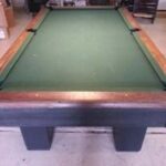 slight overhead view showing the play surface of this Brunswick Sportsman pool table.