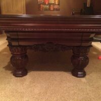 Leg detail of a Brunswick Cromwell pool table.
