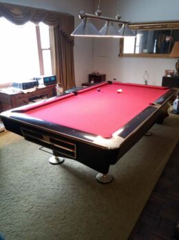 Used Brunswick Gold Crown IV in piano black pool table for sale