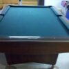 End view of a Brunswick Gold Crown III pool table.