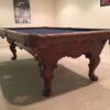 End and leg view of Queen Anne pool table.