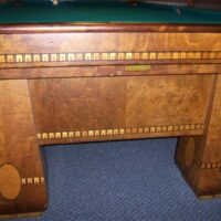 massive sturdy legs hold this antique Brunswick Medalist table.