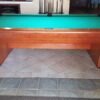 long view of the Brunswick Gibson pool table.