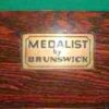 Rare 'medalist' plaque for the brunswick label on a Medalist pool table.