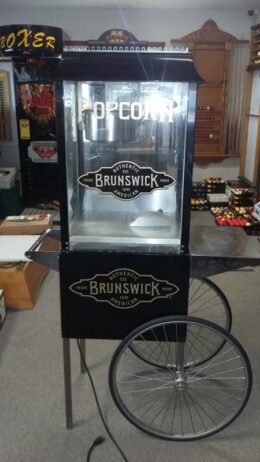 Brunswick automatic popcorn machine in black.