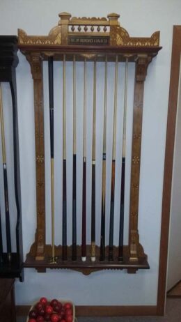 Brunswick Exposition novelty cue rack on the wall in our shop.
