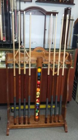 floor standing Centennial cue rack from Brunswick in solid cherry