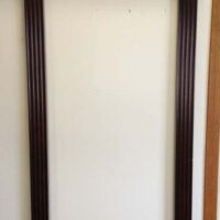 Windsor cue rack from Brunswick billiards shown on our wall.
