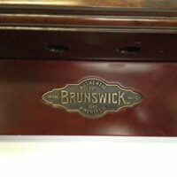 Brunswick plaque on the windsor cue rack.