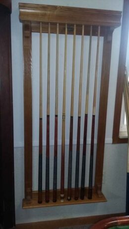 Beautiful solid wood wall mounted cue rack from Brunswick Billiards.
