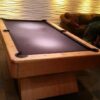 end view of an Olhausen Waterfall pool table. Notice the 2 spot lighting and how it really makes this pool table stand out.