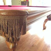 Leather and fringe pocket on Brunswick Brookstone 2 pool table.
