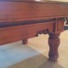 Closeup of skirt and leg on a Brunswick Dominion pool table.