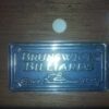 Brunswick Billiards logo plate on the Bridgeport pool table.