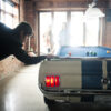 player takes aim for a game winning shot on a Shelby car pool table.