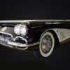 beautiful front right shot of a collectors edition 1959 Chevy Corvette pool table in black on a black background.