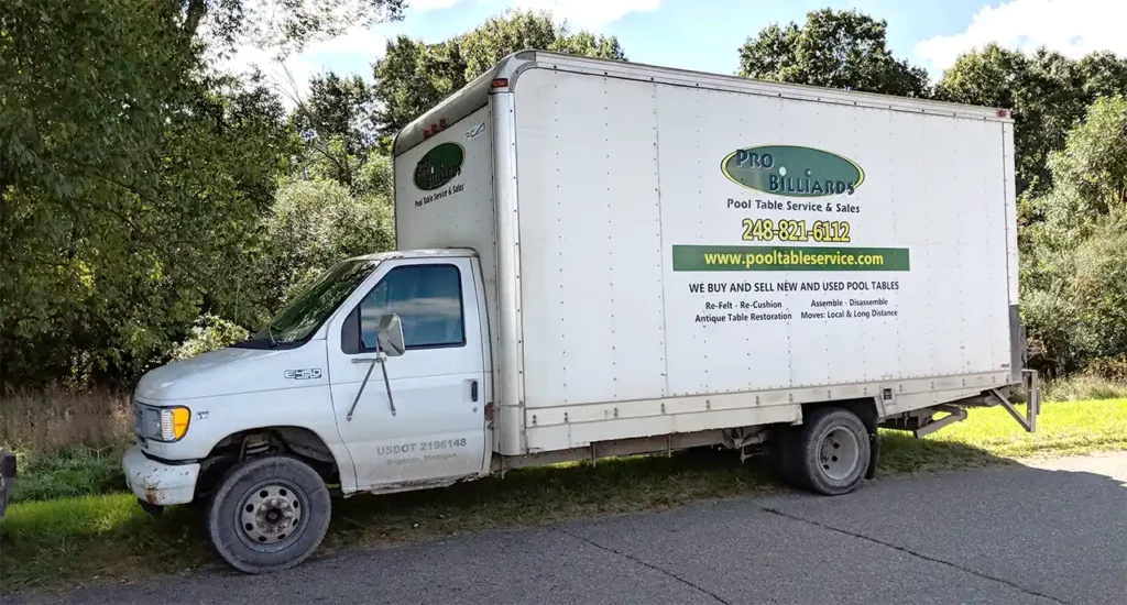 A pool table moving box truck