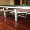side view of a Riley Aristocrat snooker table detailing the fabulous character of its 8 legs.
